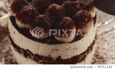 Enjoying Tiramisu in restaurant Enjoying Tiramisu in restaurant 79711182