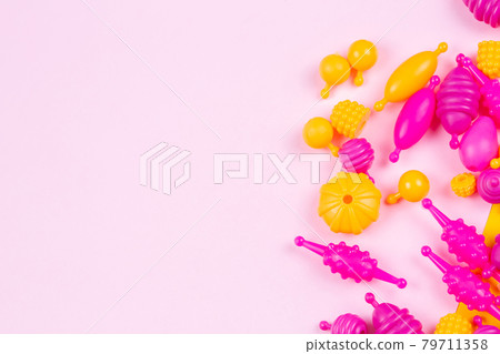 Multicolored plastic beads for a girl's bracelet from a set for needlework 79711358