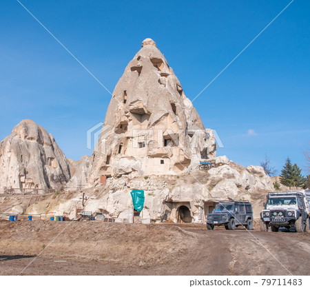 Volcanic mountain with windows near the city of Goreme in Turkey. Cappadocia. Volcanic mountain with windows near the city of Goreme in Turkey. Cappadocia. 79711483