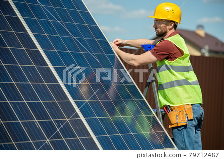 Engineer Installing Solar Panel Engineer Installing Solar Panel 79712487
