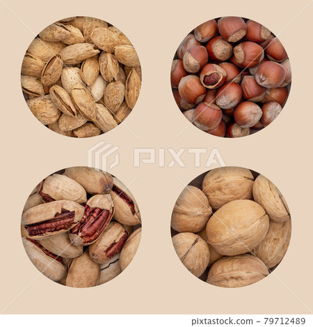 Four types of unpeeled nuts in holes on an eco background. Four types of unpeeled nuts in holes on an eco background. 79712489