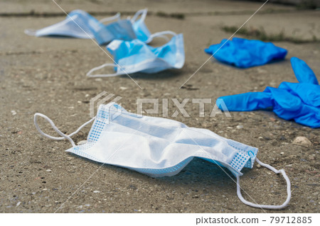 The used mask lies on the road The used mask lies on the road 79712885
