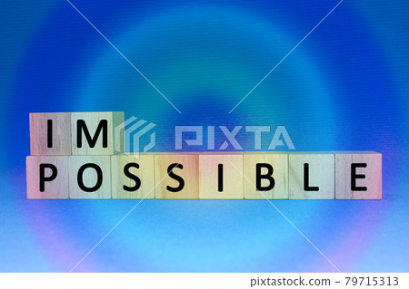 Impossible text on wooden cubes on a colorful gradient background 79715313