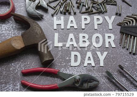 Happy labor day text with many handy tools on grunge grey concrete background Happy labor day text with many handy tools on grunge grey concrete background 79715529