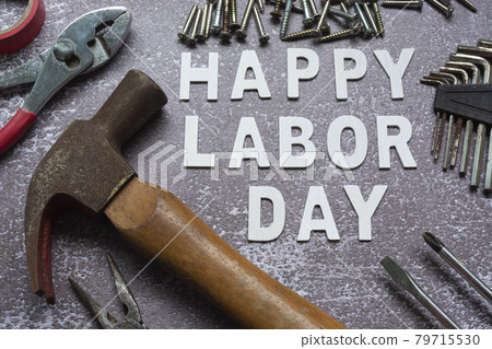 Happy labor day text with many handy tools on grunge grey concrete background Happy labor day text with many handy tools on grunge grey concrete background 79715530