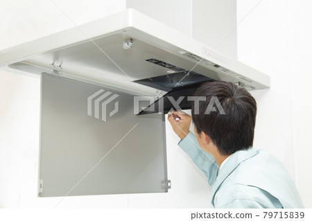 Workers inspecting the ventilation fan 79715839