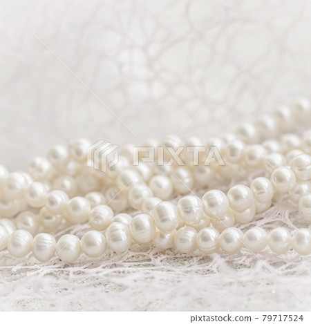 Nature white string of pearls in soft focus, with highlights Nature white string of pearls in soft focus, with highlights 79717524
