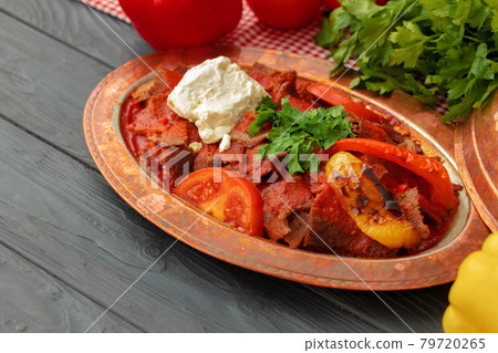 Turkish Meat Saute with vegetables in copper plate 79720265