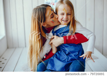 Mom and daughter are drawing 79720891