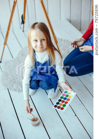 Mom and daughter are drawing 79720896