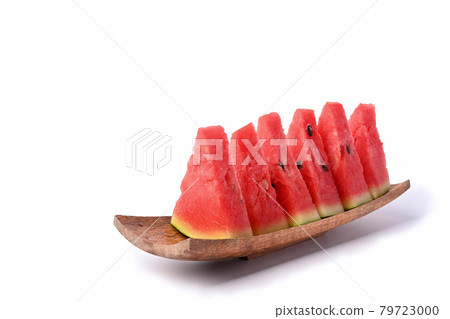 Fresh sliced watermelon on wooden plate. Fresh sliced watermelon on wooden plate. 79723000
