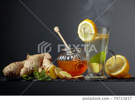 Ginger tea with lemon, mint and honey. Ginger tea with lemon, mint and honey. 79723817