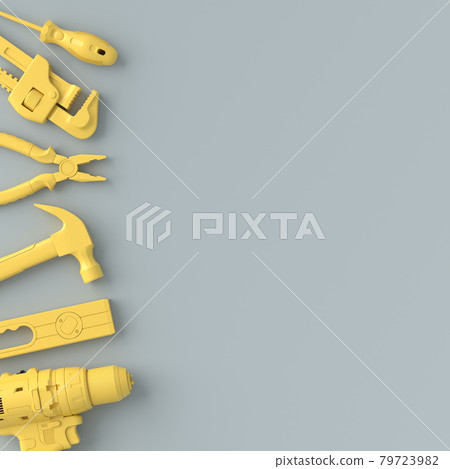Top view of monochrome construction tools for repair on grey and yellow Top view of monochrome construction tools for repair on grey and yellow 79723982