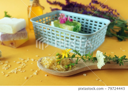 Aromatic oil, medicinal herbs, natural soap and salt on a bright background, concept of spa, body care, alternative medicine, home cosmetics preparation 79724443