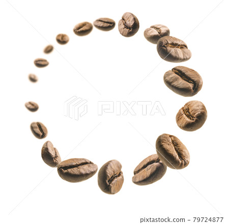 Coffee beans levitate on a white background Coffee beans levitate on a white background 79724877