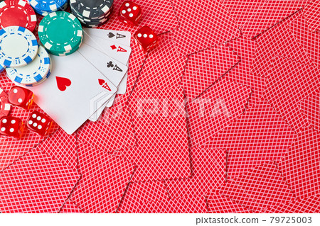 Casino chips, playing cards and dices on dark reflective background Casino chips, playing cards and dices on dark reflective background 79725003