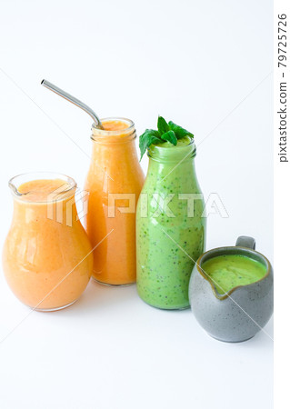Seasonal Matcha green vegan smoothie with chia seeds and mint pumpkin carrot smoothie drink detox Breakfast. Clean eating, weight loss, healthy dieting food concept Seasonal Matcha green vegan smoothie with chia seeds and mint pumpkin carrot smoothie drink detox Breakfast. Clean eating, weight loss, healthy dieting food concept 79725726