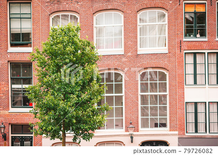 Traditional dutch medieval houses in Amsterdam capital of Netherlands Traditional dutch medieval houses in Amsterdam capital of Netherlands 79726082