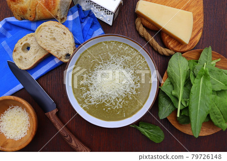 Green spring, summer healthy cream soup of sorrel with parmesan cheese, delicious homemade dinner . Green spring, summer healthy cream soup of sorrel with parmesan cheese, delicious homemade dinner . 79726148