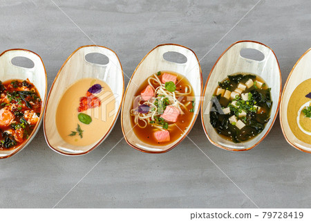 Tom Yam, Miso soup and cream soups on gray table 79728419