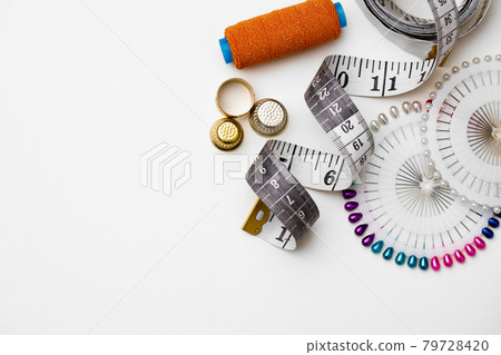 Various sewing accessories isolated on white background Various sewing accessories isolated on white background 79728420