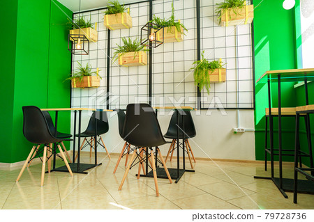 Coffee shop interior background with tables and chairs 79728736