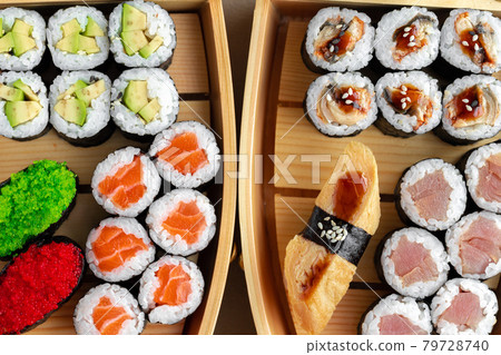 Set of maki sushi on wooden boat tray Set of maki sushi on wooden boat tray 79728740