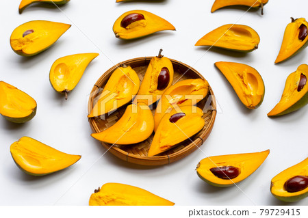 Canistel fruit on white background. 79729415