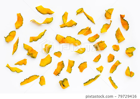 Green pumpkin slice chips on white background. 79729416