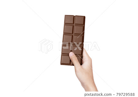 Human hand holding chocolate bar 79729588