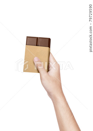 Human hand holding chocolate bar 79729590