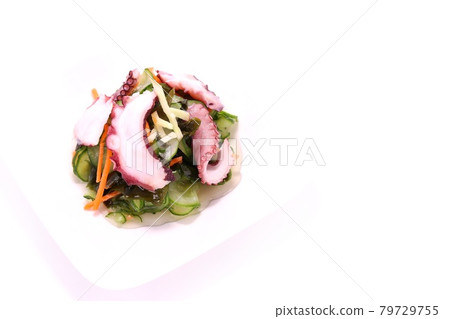 Octopus vinegared cucumber wakame seaweed bright background 79729755