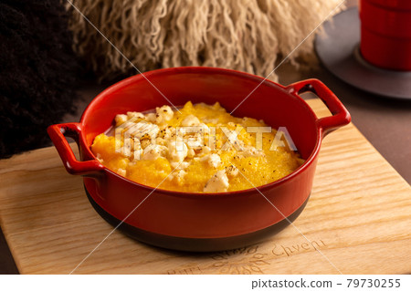 Elarji porridge from coarse cornmeal with Sulguni cheese 79730255