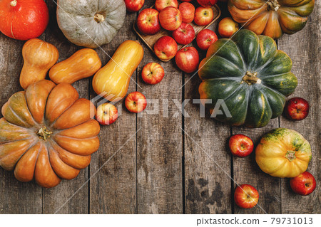 Colorful autumn background with pumpkins and apples 79731013
