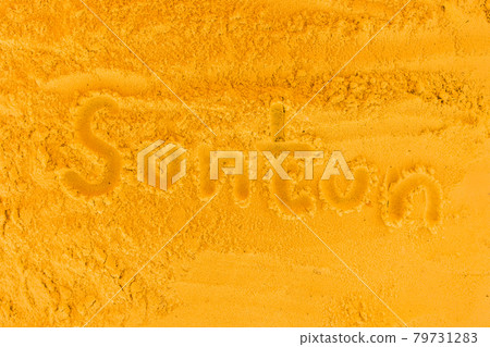 The word tan is written on the orange beach sand. Sign and symbol of skin color change The word tan is written on the orange beach sand. Sign and symbol of skin color change 79731283