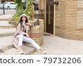 woman sitting on the steps 79732206