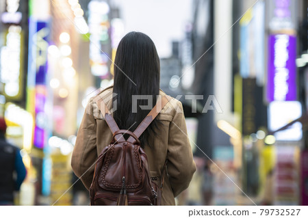 Young asian woman traveler traveling and shopping in Myeongdong street 79732527