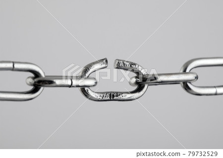 Broken silver metal chain, concept of freedom. Broken silver metal chain, concept of freedom. 79732529