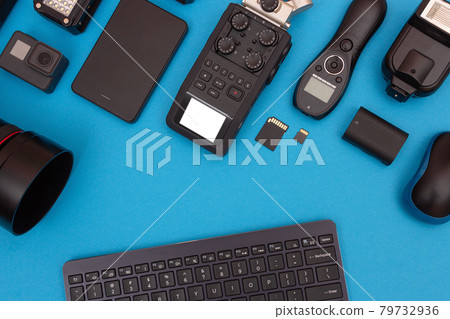 Workplace With Digital Gadgets on Blue Table Workplace With Digital Gadgets on Blue Table 79732936