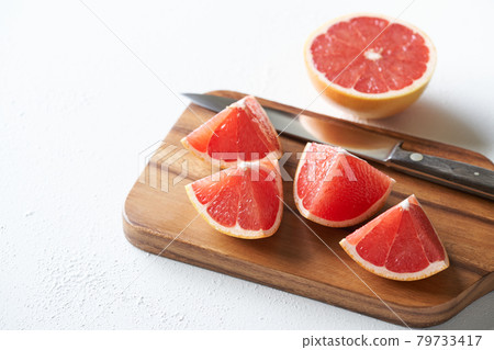 Cut pink grapefruit Cut pink grapefruit 79733417