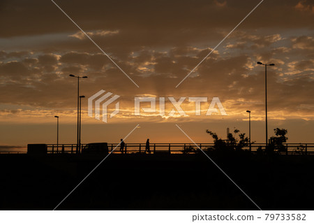 Beautiful sunset clouds shining in the setting sun 79733582