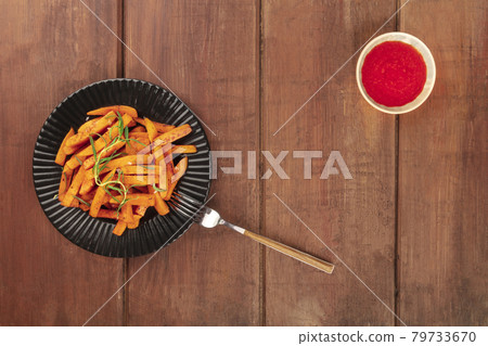 Roasted sweet potato fries with rosemary and ketchup, shot from the top Roasted sweet potato fries with rosemary and ketchup, shot from the top 79733670