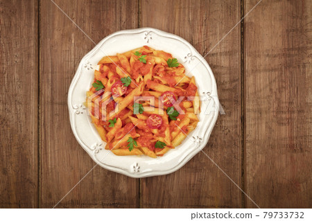 Penne pasta photo with tomato sauce and place for text Penne pasta photo with tomato sauce and place for text 79733732