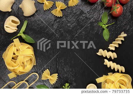 Overhead photo of different types of pasta on black Overhead photo of different types of pasta on black 79733735