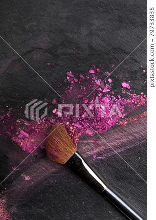 Closeup of makeup brush with eye shadows on black with copy space Closeup of makeup brush with eye shadows on black with copy space 79733838