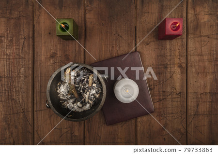 Overhead photo of cauldron, grimoire, candles, and copy space 79733863