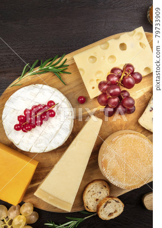 Various types of cheese on rustic background with copyspace 79733909