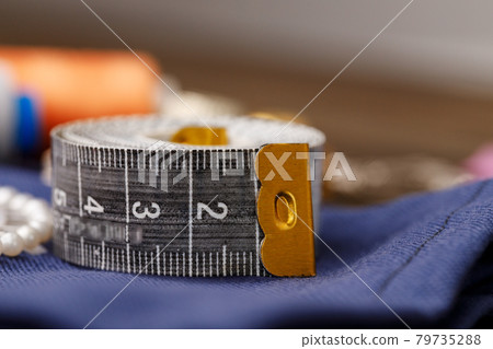 Close up of sewing accessories on table 79735288