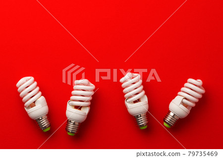 LED light bulbs on red background top view 79735469