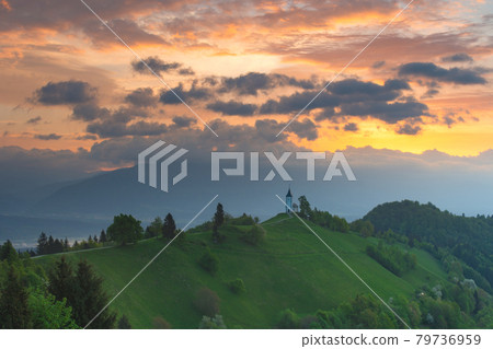 Charming little St. Primus and Felician church in Jamnik, Julian Alps, Slovenia and beautiful sunrise sky colors Charming little St. Primus and Felician church in Jamnik, Julian Alps, Slovenia and beautiful sunrise sky colors 79736959